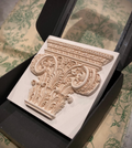 Corinthian plaster paperweight, signed and number. Aged plaster detail.